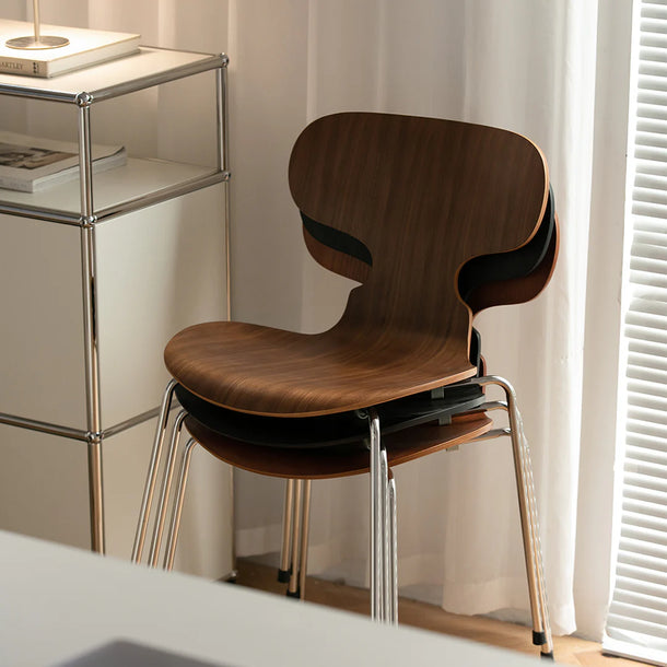 Wooden chair with metal legs in a room setting