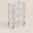 A three-tier clear acrylic rolling storage cart with integrated handles and caster wheels, shown on a solid beige background.