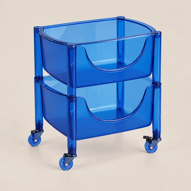 A translucent blue plastic rolling storage cart with two tiered bins and caster wheels, shown on a solid light beige background.