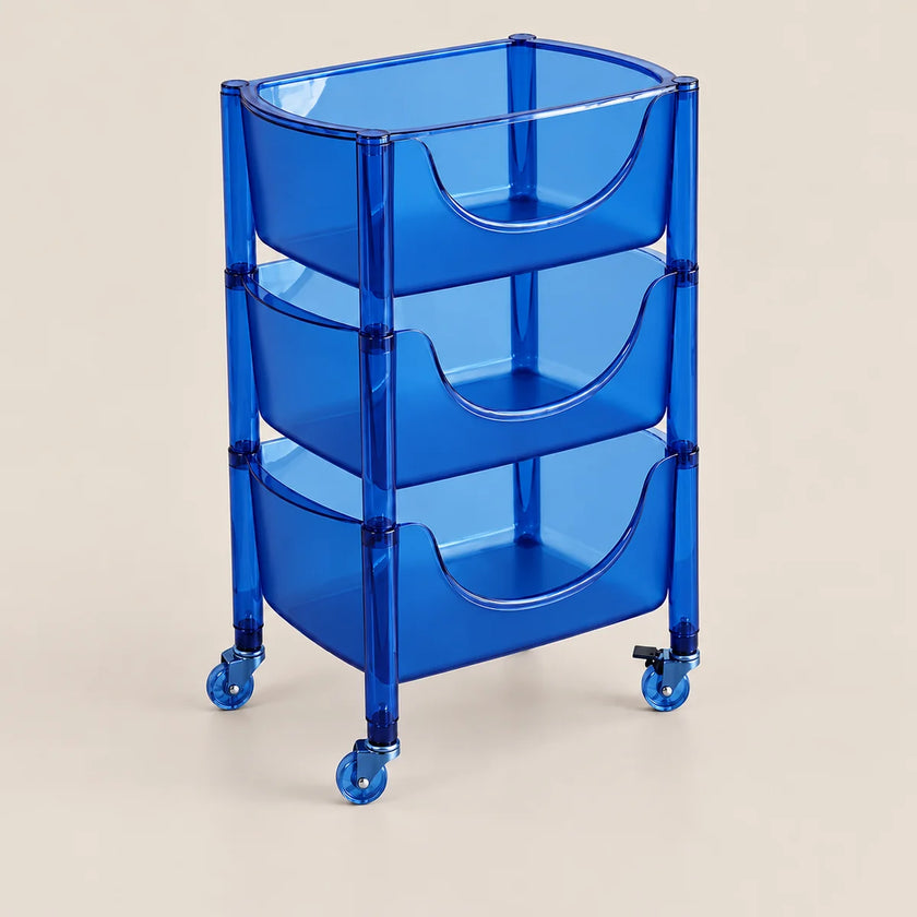 A translucent blue three-tier rolling storage cart with curved pull-out bins and casters, shown on a plain light beige studio background.