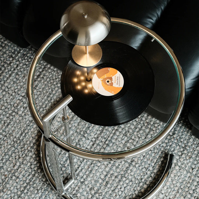 Record player with a vinyl record on a textured surface
