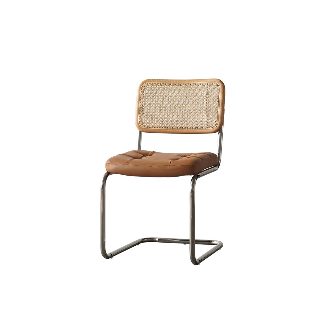Chair with brown leather seat and woven backrest on a white background