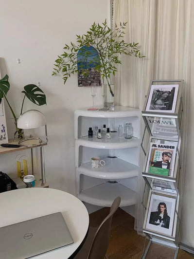 Home office with a desk, shelves, and decorative items.