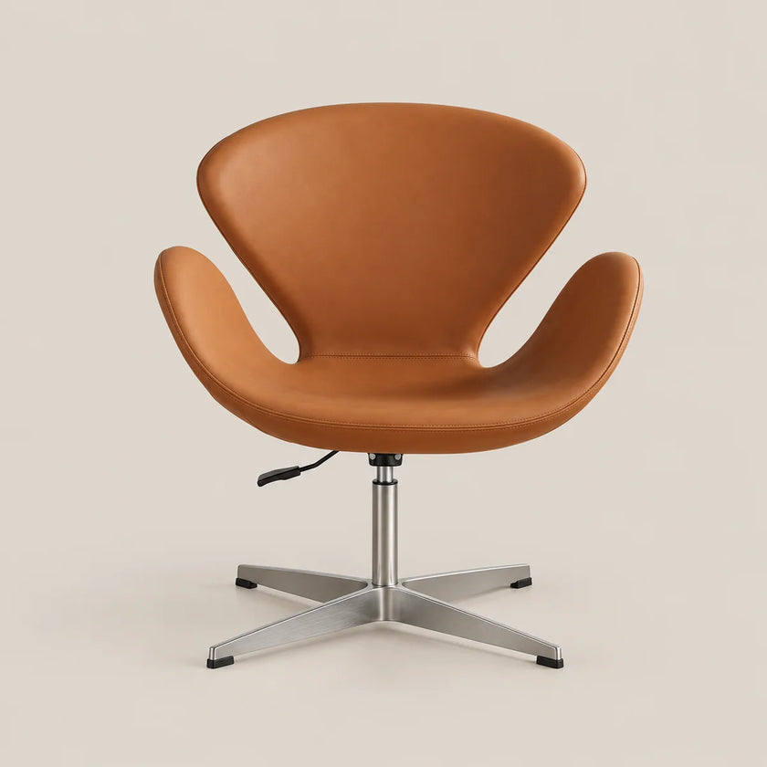 A modern swivel lounge chair with a warm tan leather shell and a silver metal four-star base, photographed against a solid light beige background.