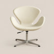 An off-white molded plastic swivel chair with a chrome five-star base, shown against a solid beige background.