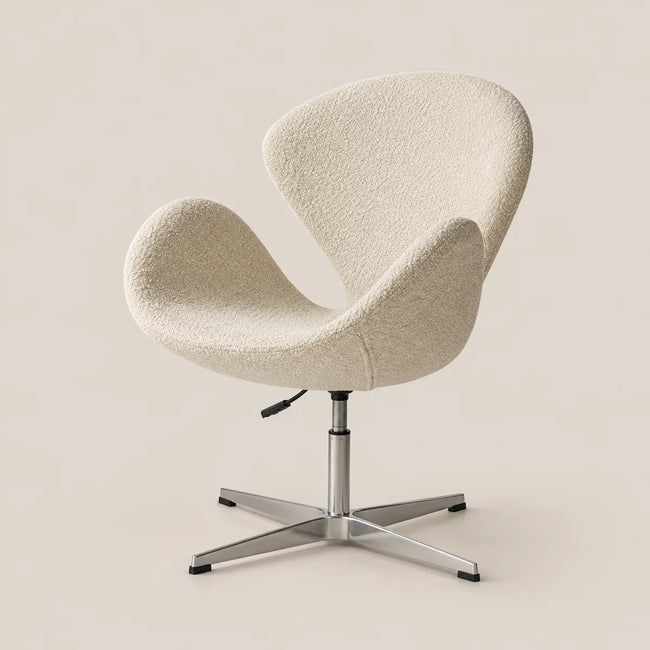 A modern swivel lounge chair with a textured cream bouclé fabric shell and a chrome four-star base, set against a solid light beige background.