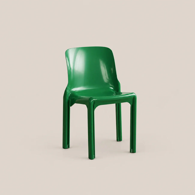 A glossy green molded plastic chair shown from a three-quarter angle against a solid, warm beige background.