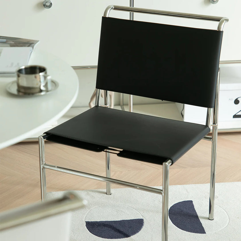 Black chair with chrome frame in a room setting