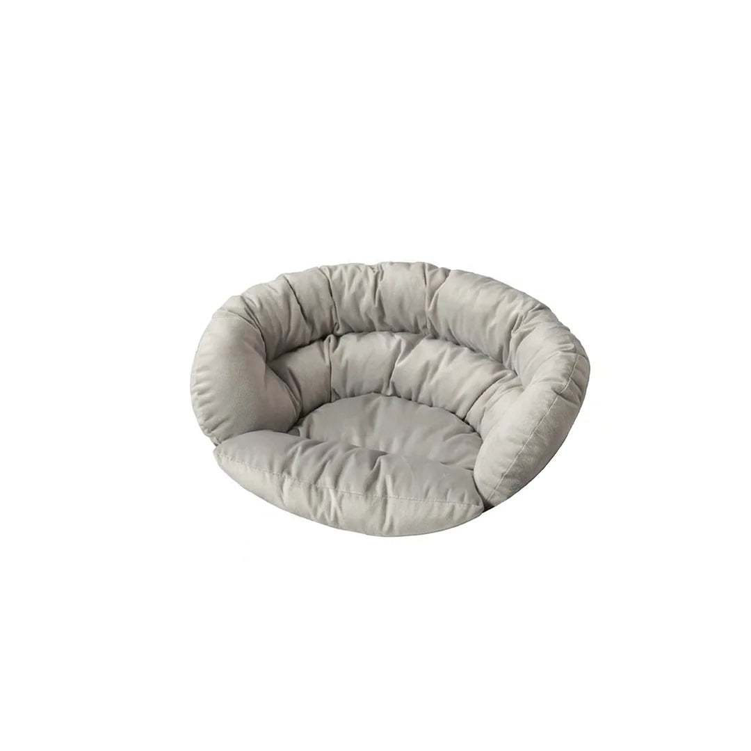 Round gray pet bed on a white background