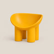 A bright yellow molded plastic children's stool with a rounded, bowl-like seat and four cylindrical legs, shown on a neutral light beige background.