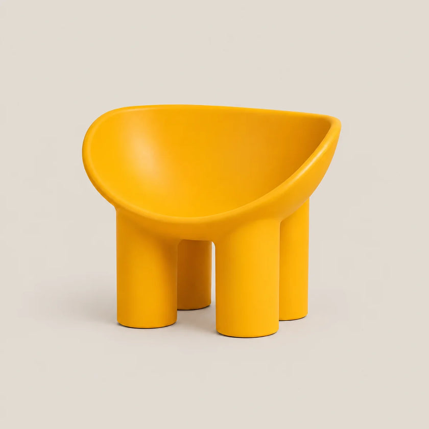 A bright yellow molded plastic children's stool with a rounded, bowl-like seat and four cylindrical legs, shown on a neutral light beige background.