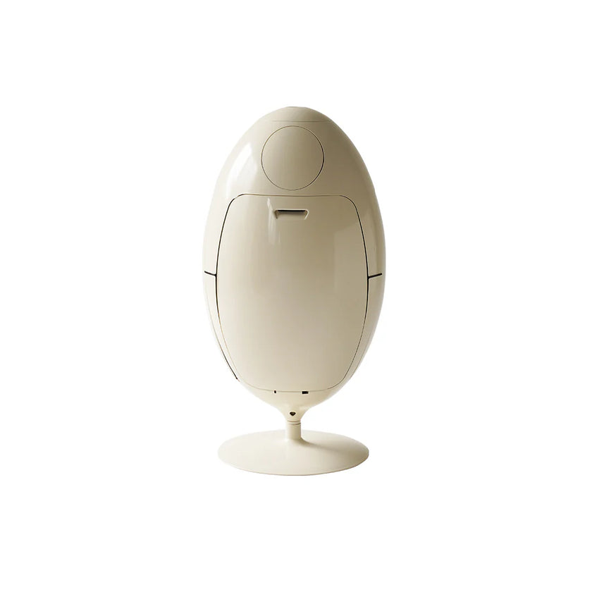 Beige electronic device with a round base on a white background
