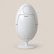 A white egg-shaped modern pedestal table or lamp with a circular top and a round base, shown against a solid beige background.