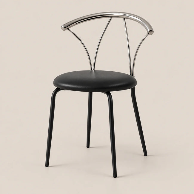 A modern dining chair with a black upholstered seat and black legs, featuring a curved polished silver metal backrest, set against a solid light beige background.