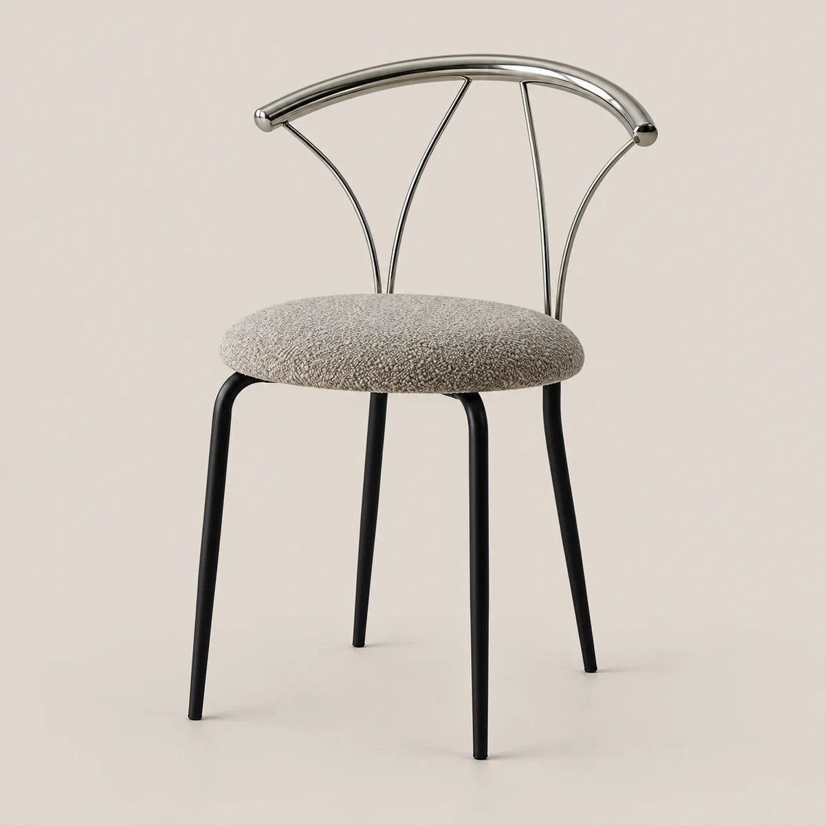A modern dining chair with a round textured gray upholstered seat, black tapered legs, and a curved polished metal backrest, shown against a solid light beige background.