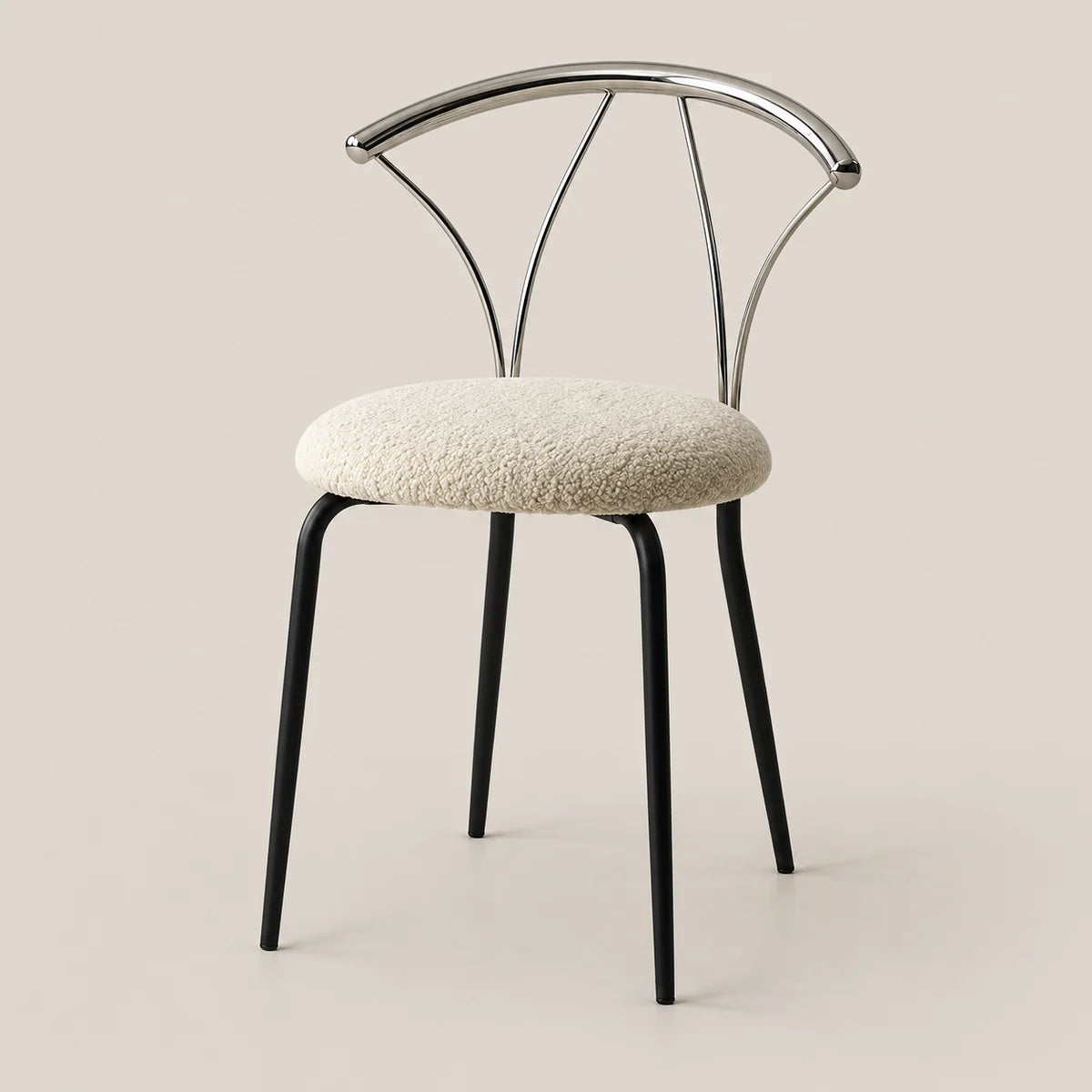 A modern dining chair with a textured cream bouclé seat cushion, black metal legs, and a curved polished silver metal backrest, set against a solid warm beige background.