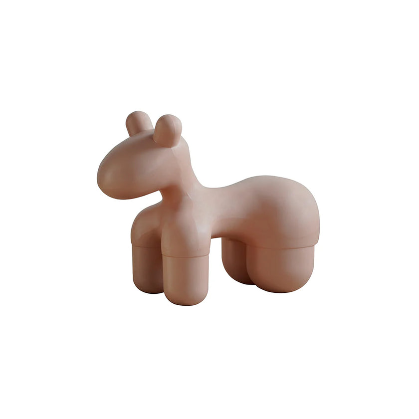 Pink unicorn-shaped container on a white background