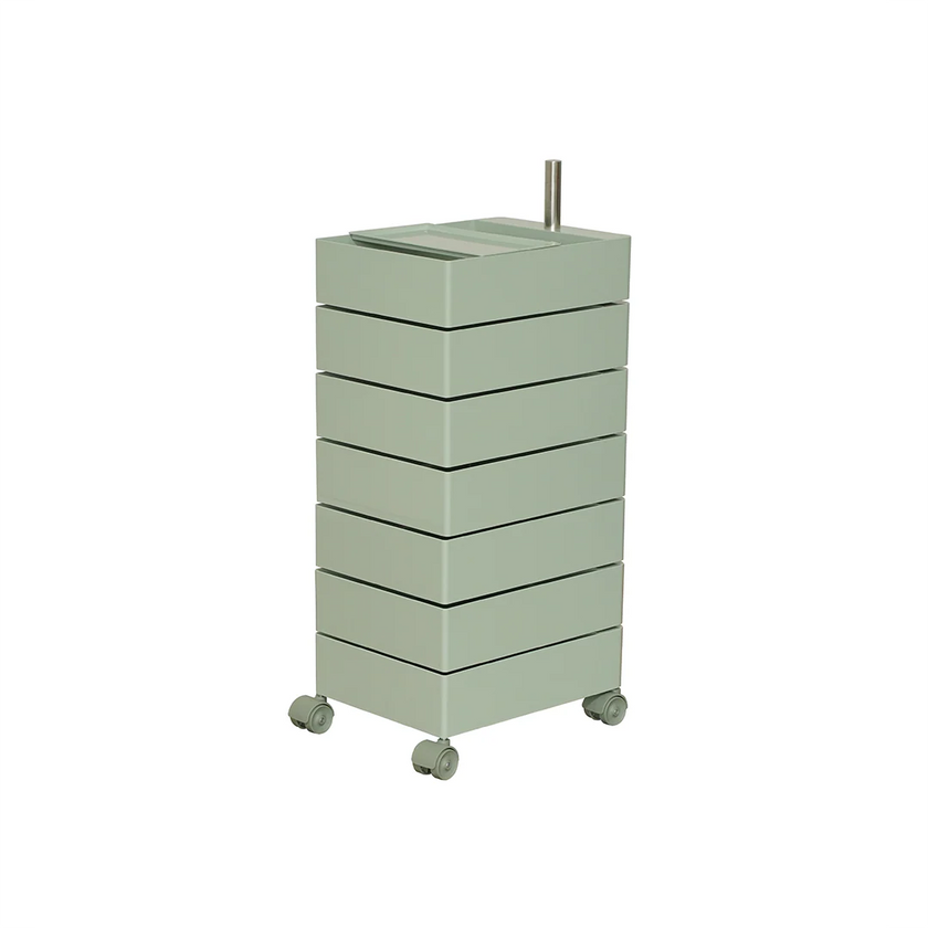 Green cylindrical storage unit with multiple drawers on a white background