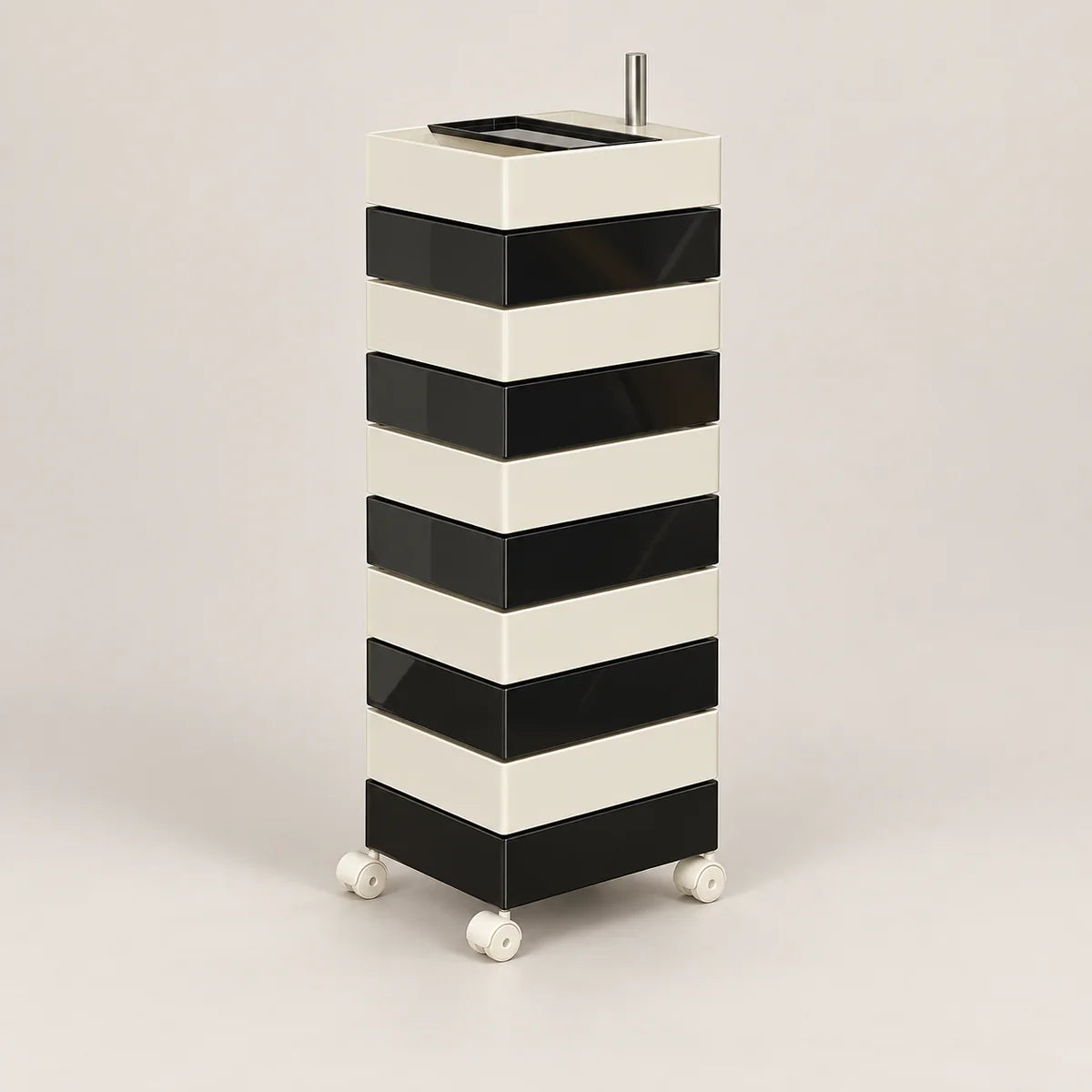 A modern black and white striped rolling storage cabinet with a top tray and small metal handle, shown on a neutral light gray background.