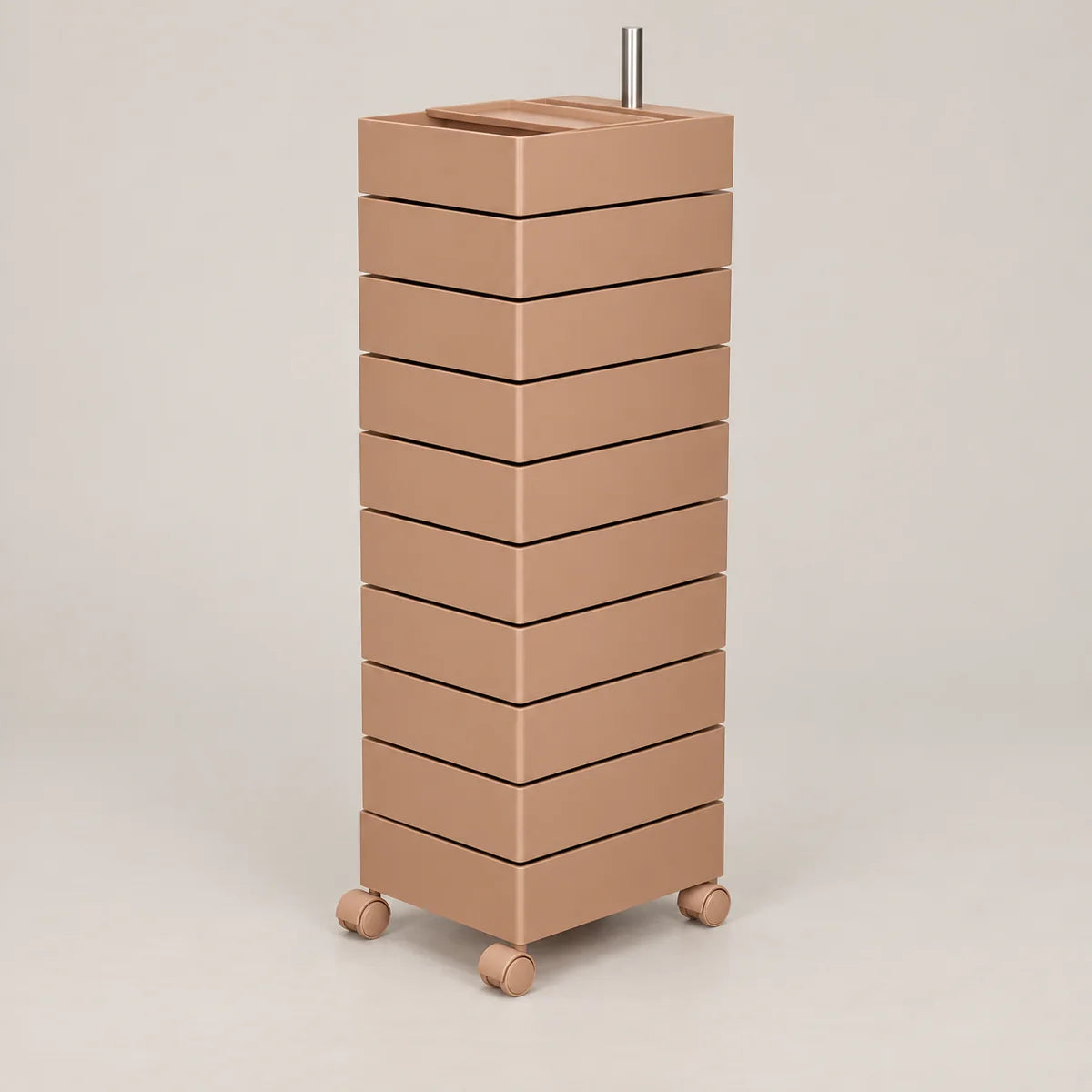 A modern, minimalist rolling storage cabinet with ten stacked rectangular drawers in a warm taupe-brown finish, featuring a built-in top tray and dual metal handles, set against a solid light beige background.