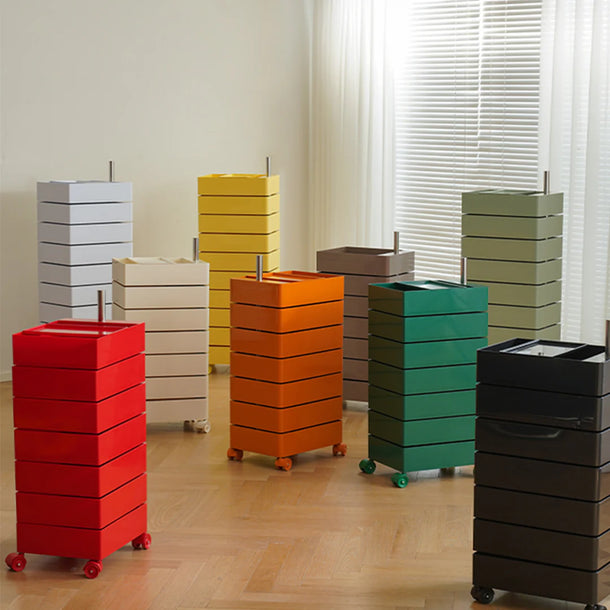Colorful storage bins with wheels on a wooden floor.