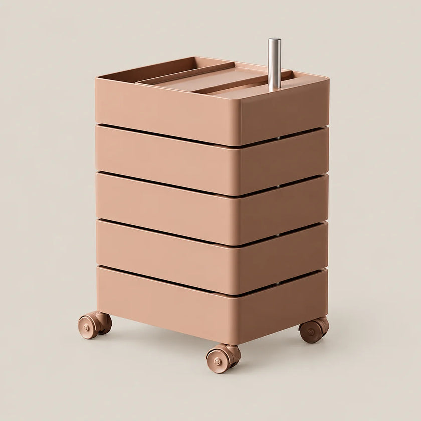 A modern five-drawer rolling storage cart in a warm dusty rose or terracotta pink, featuring a top tray, a vertical metal handle, and four caster wheels, shown on a solid light beige background.