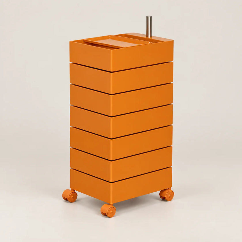 An orange rolling storage cart with six stacked drawers and a metal handle on top, photographed on a clean light gray studio background.