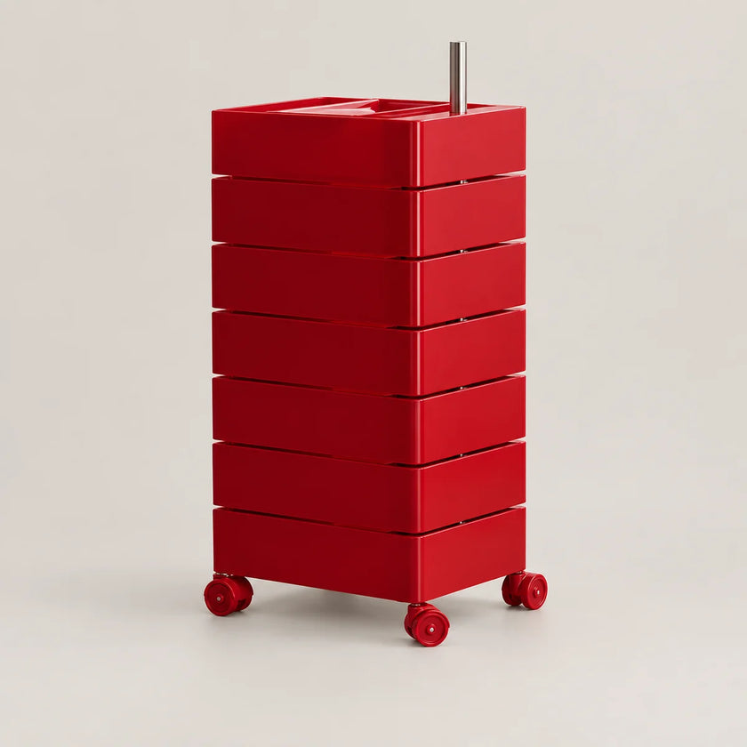A red rolling storage cart with eight stacked drawers and a metal handle, photographed on a clean light gray studio background.