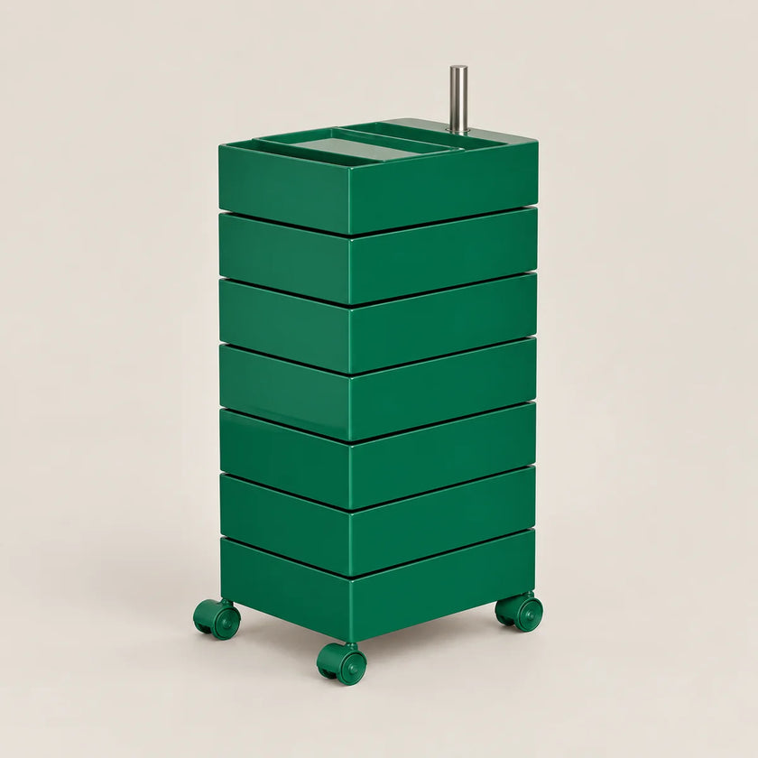 A green rolling storage cart with six stacked drawers and a metal handle on top, shown on a plain beige studio background.