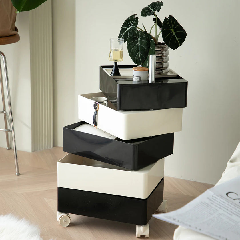 Black and white storage unit with drawers in a room setting.
