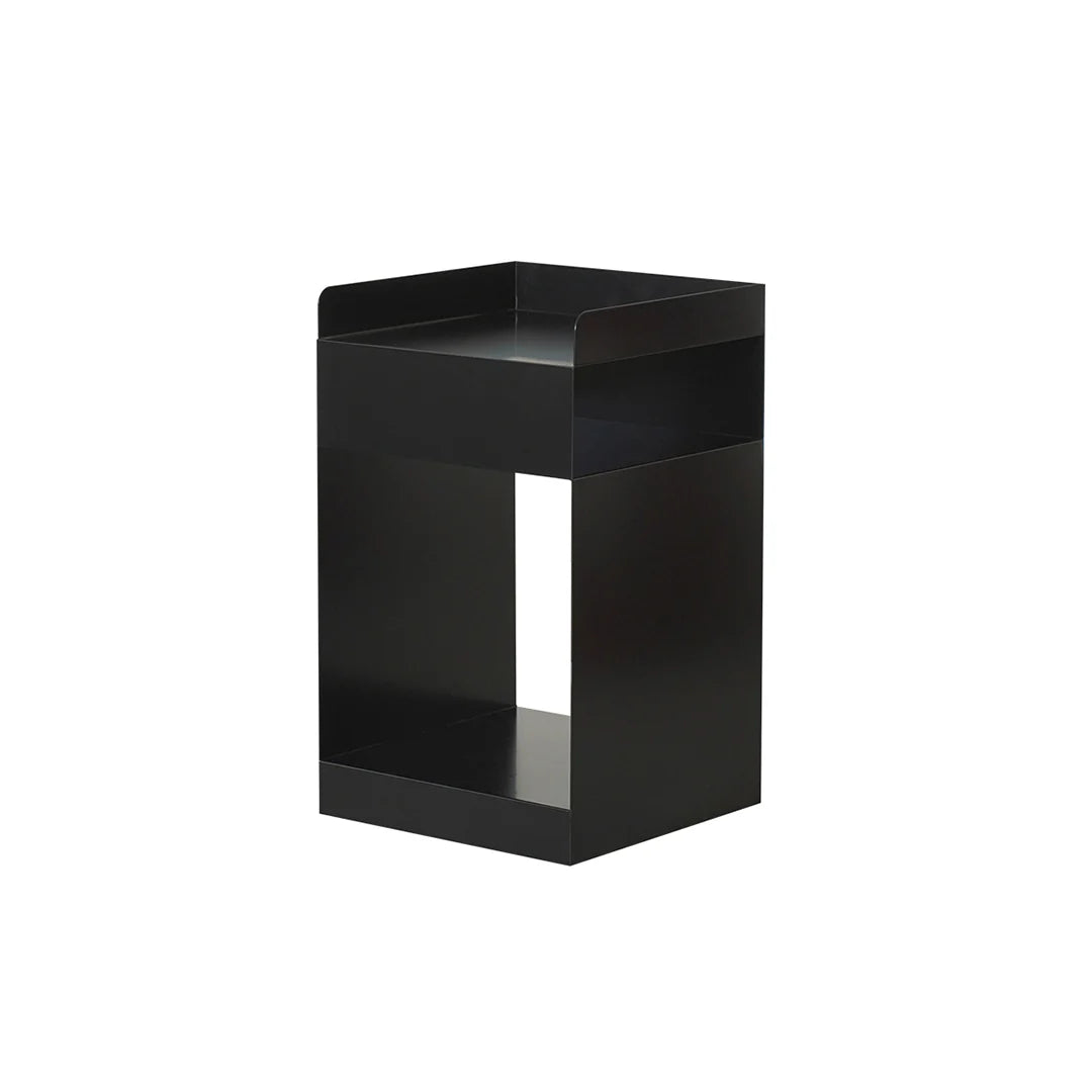 Black metal side table on a white background