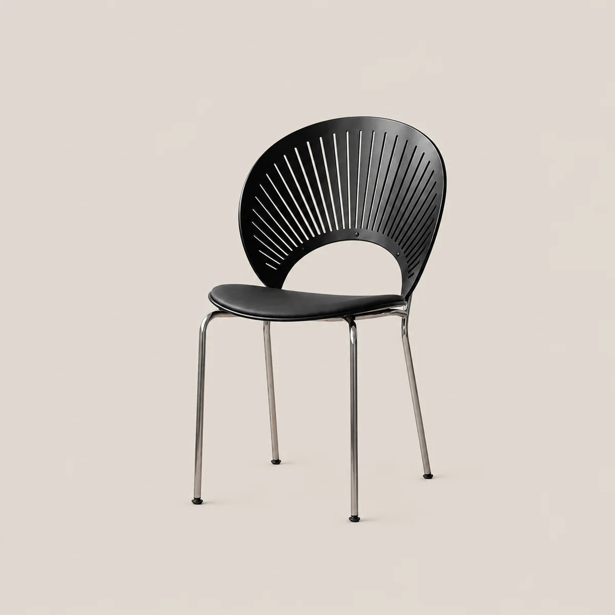 A modern black plastic dining chair with a slatted backrest and slim metal legs, shown against a solid light beige background.