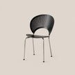 A modern black slatted chair with a curved backrest and thin metal legs, shown against a solid light beige background.