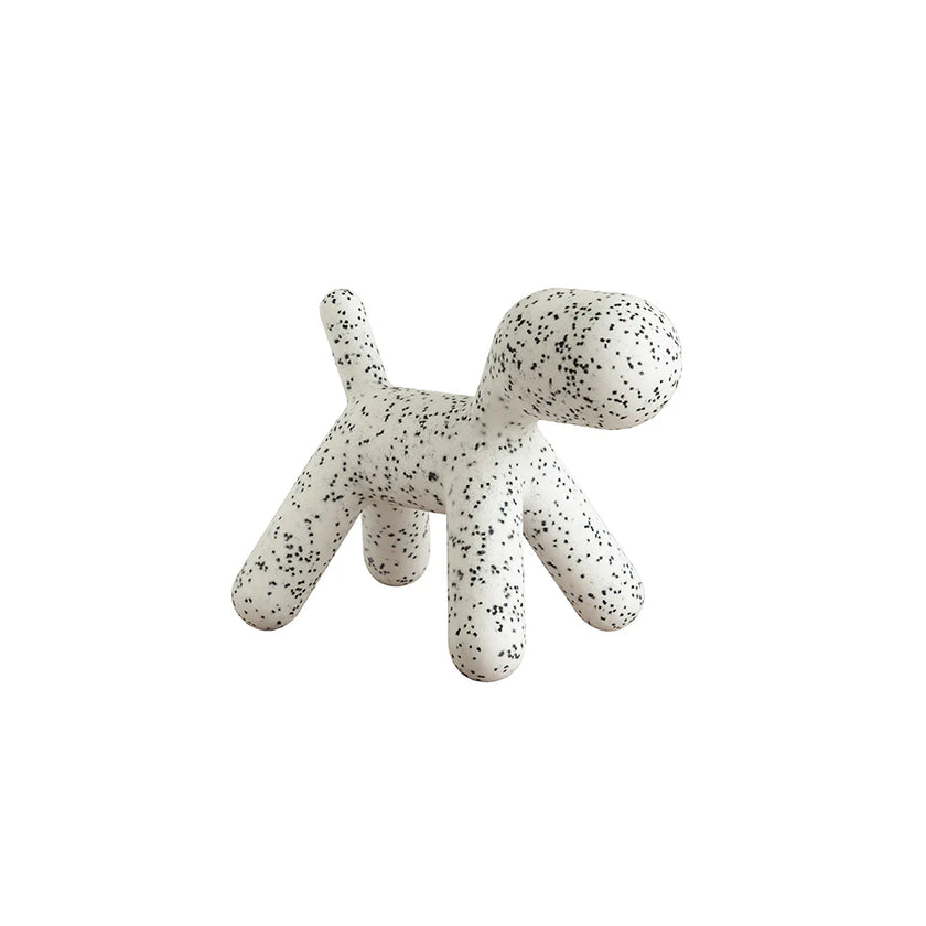 Speckled white and gray dog-shaped object on a white background