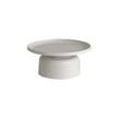 Round coffee table with a white base and light gray top on a white background
