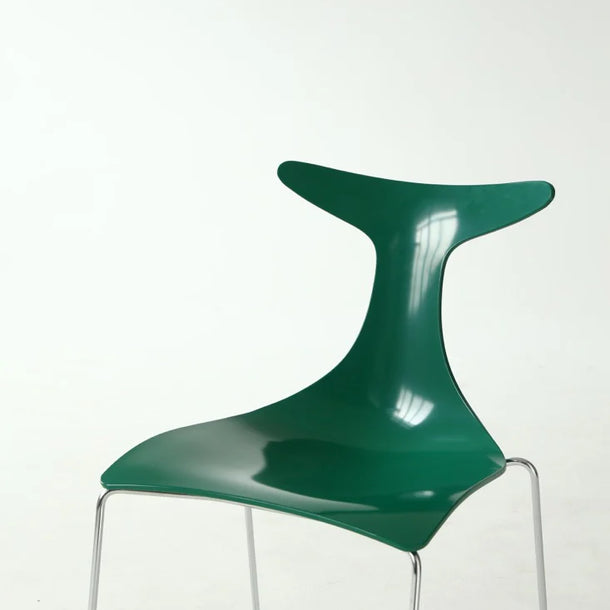Modern green chair with a transparent base on a white background