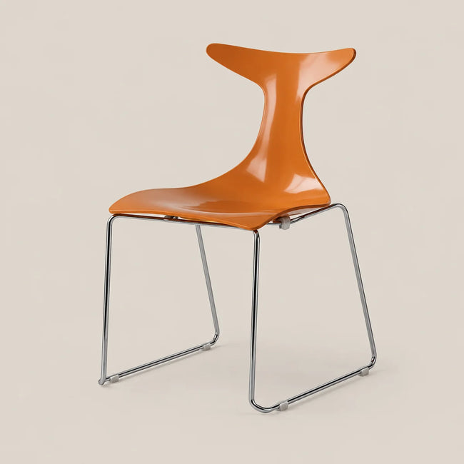 An orange molded plastic chair with a chrome metal frame, shown against a solid beige background.