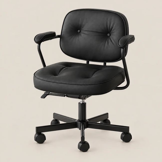 A black office desk chair with a tufted backrest and seat cushion, black armrests, and a five-wheel base, shown against a solid light beige background.