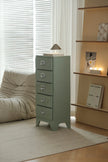 Green metal cabinet with drawers in a room with a couch and shelves.