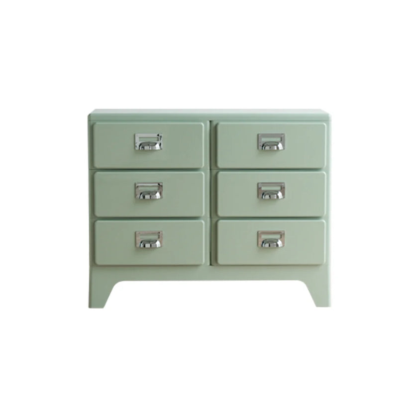 Light green dresser with six drawers on a white background