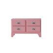 Pink dresser with four drawers on a white background