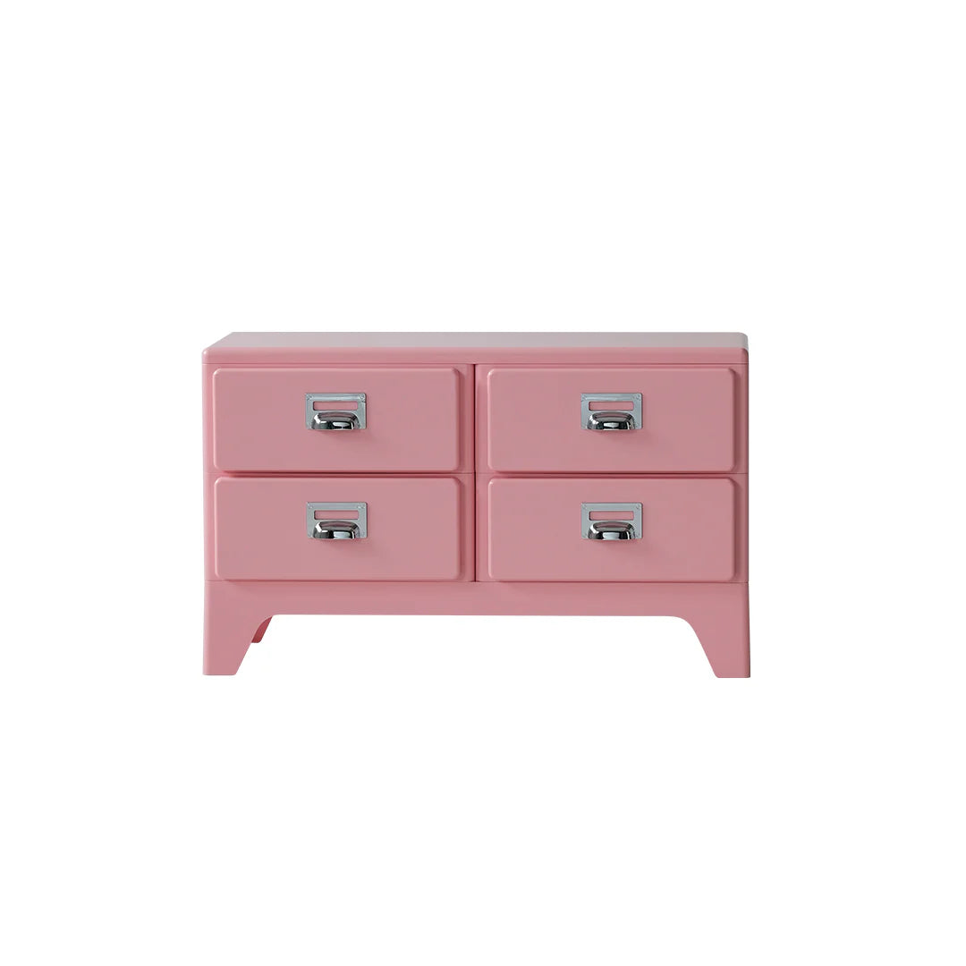 Pink dresser with four drawers on a white background