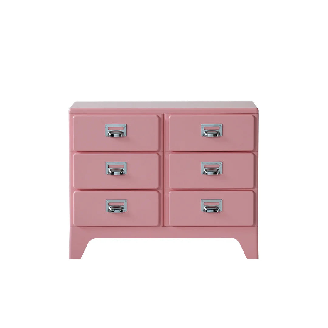 Pink dresser with six drawers on a white background