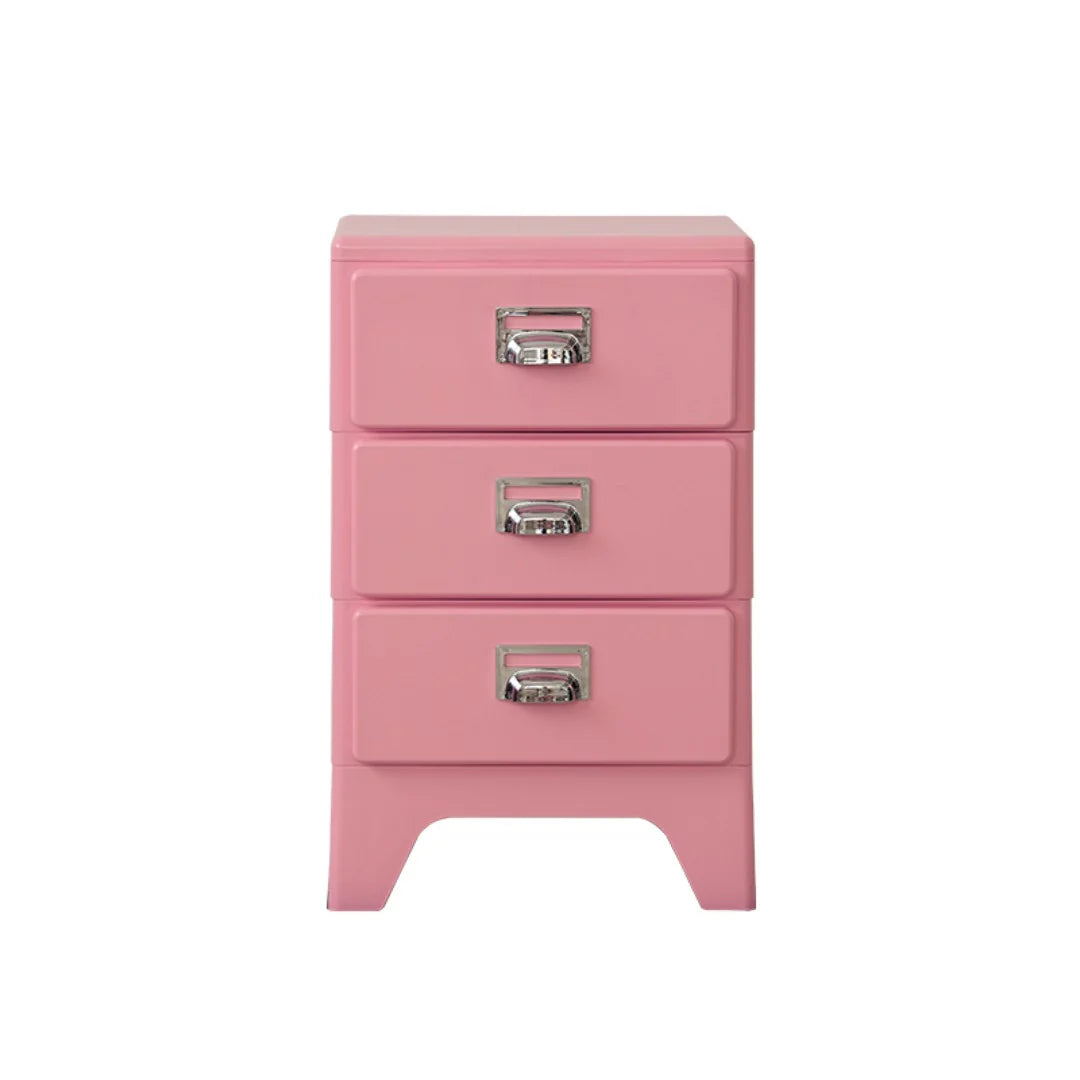 Pink nightstand with three drawers on a white background
