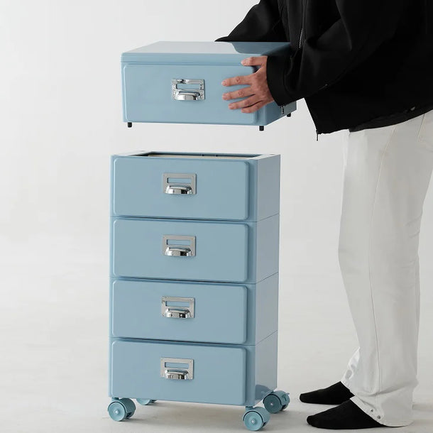 Person lifting a light blue storage box from a set of matching boxes on wheels.