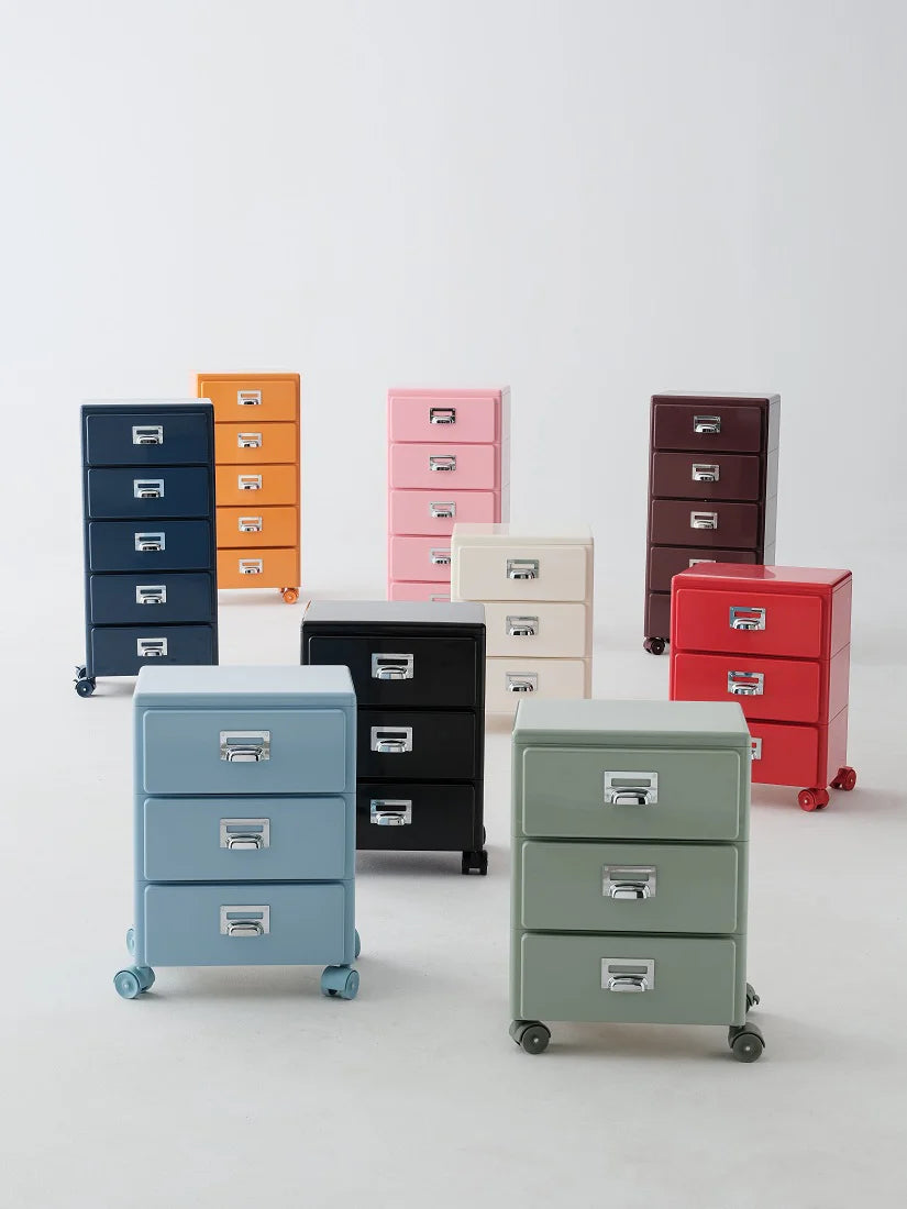 Collection of colorful filing cabinets on wheels against a white background