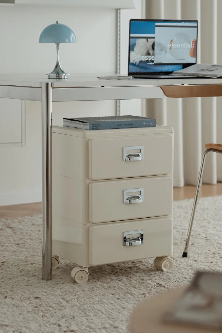 Beige abs file cabinet with drawers in a home office setting.