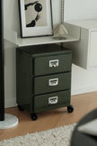 Green abs file cabinet with three drawers in a room setting.