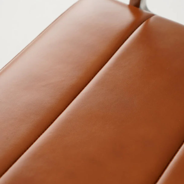 Close-up of a brown leather seat