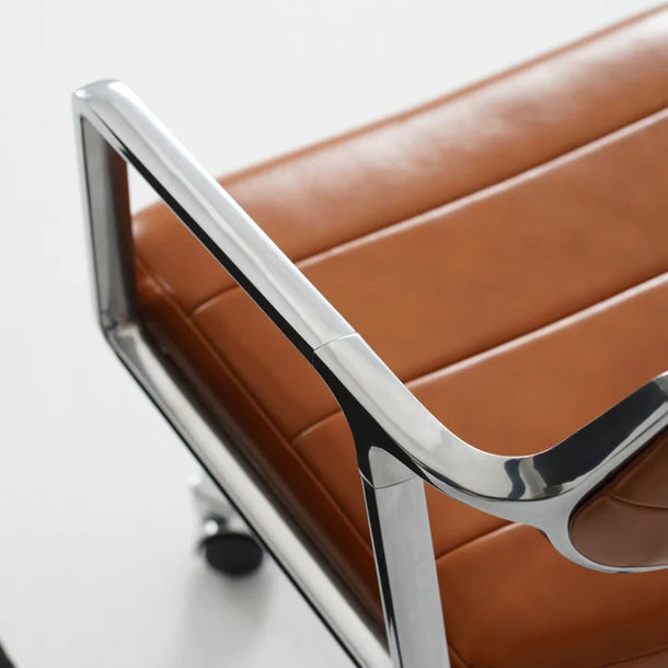 Brown chair with a metal frame on a white background